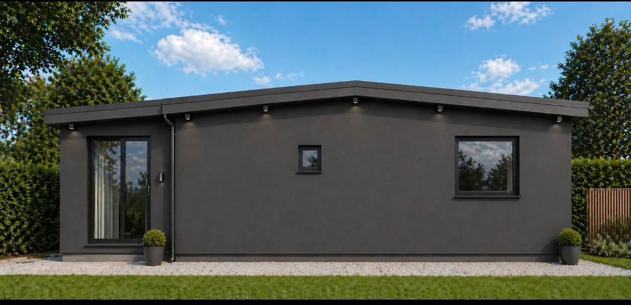 Façade avant de la maison rénovée de Bex, enduit anthracite et baie vitrée coulissante